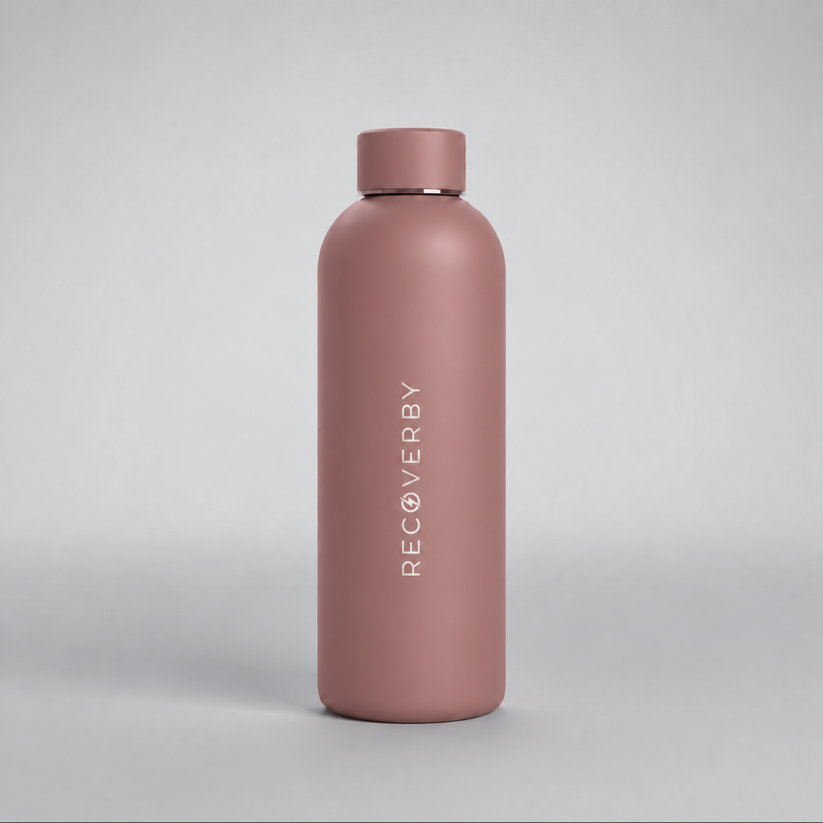 A matte dusty rose pink water bottle with a matching lid, featuring the brand name 'RECOVERBY' printed vertically in white on the front, set against a clean light gray background.