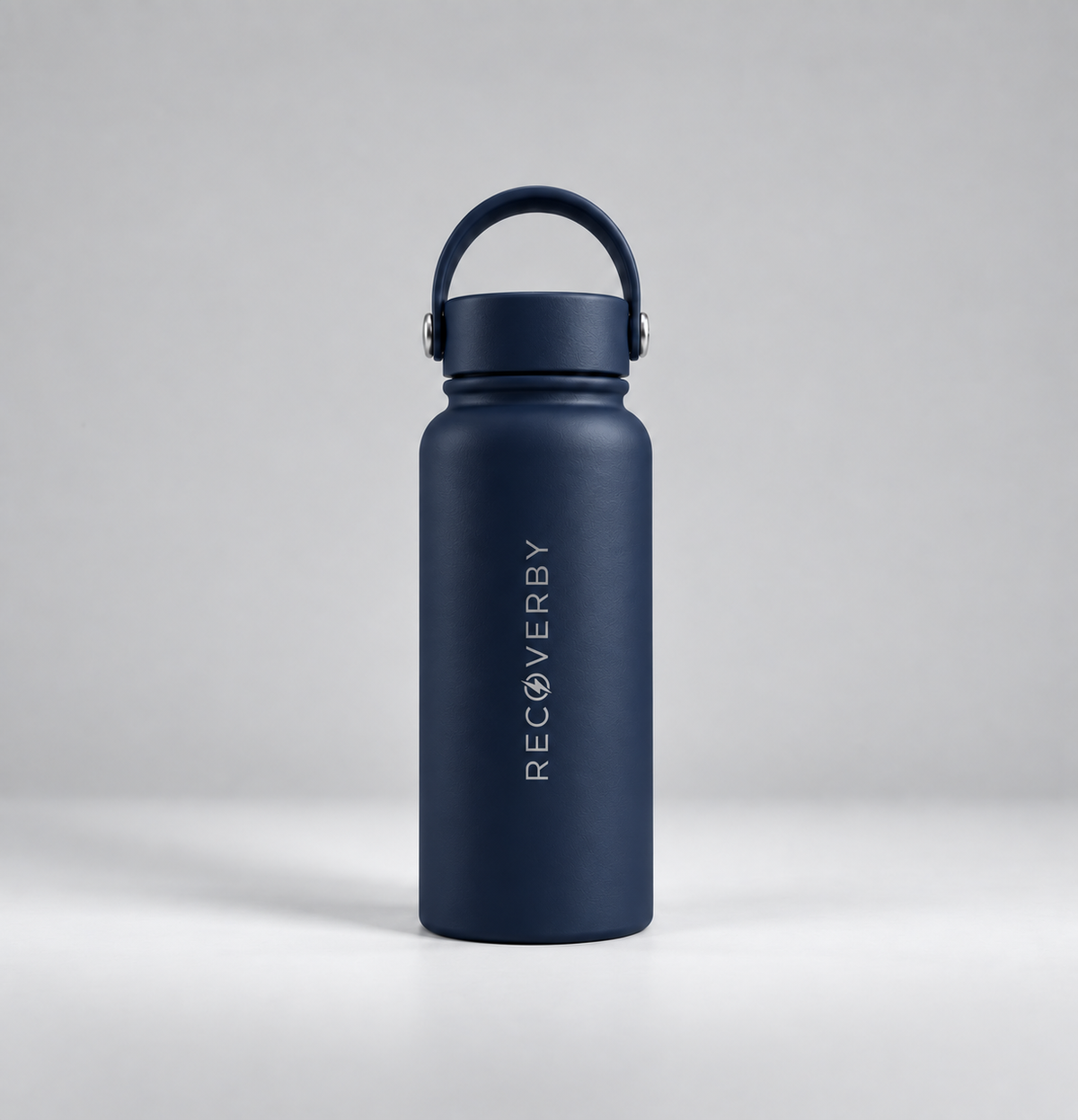 A navy blue insulated water bottle with a matching lid and carrying loop, featuring the vertical white brand name 'RECOVERBY' on the front, set against a neutral gray studio background.